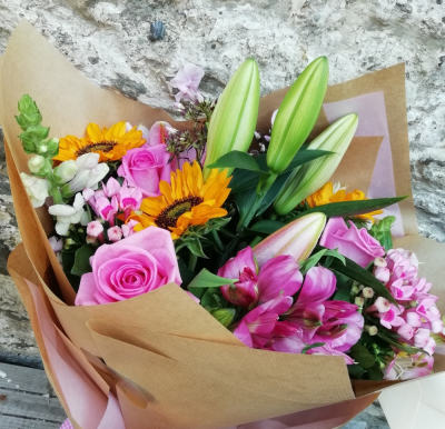 Sunshine and Pinks - Sunflowers surounded by shades of pink flowers, beautifully arranged ready to go in a vase. The perfect gift for any home.